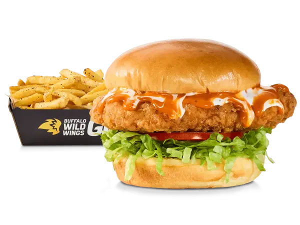 A crispy spicy chicken sandwich served in a soft bun with pickles, accompanied by a side of fries, labeled with 1060 calories.