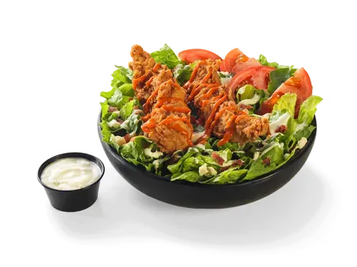 A bowl of buffalo grilled chicken salad with spicy chicken pieces, lettuce, tomatoes, and a side of dressing, priced at $12.99 with 790 calories.