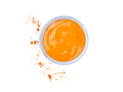 Mild sauce with smooth orange texture and light spice level