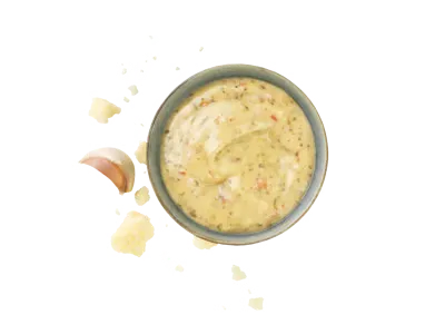 Parmesan garlic sauce with creamy consistency and visible garlic pieces