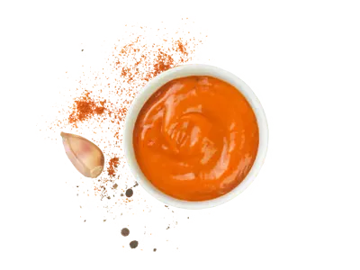 Spicy garlic sauce with orange tone and bold garlic flavor