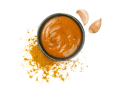 Thai curry sauce with creamy orange texture and aromatic spice