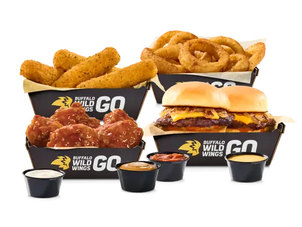 Buffalo Wild Wings ultimate sampler with wings sliders onion rings mozzarella sticks and dipping sauces.